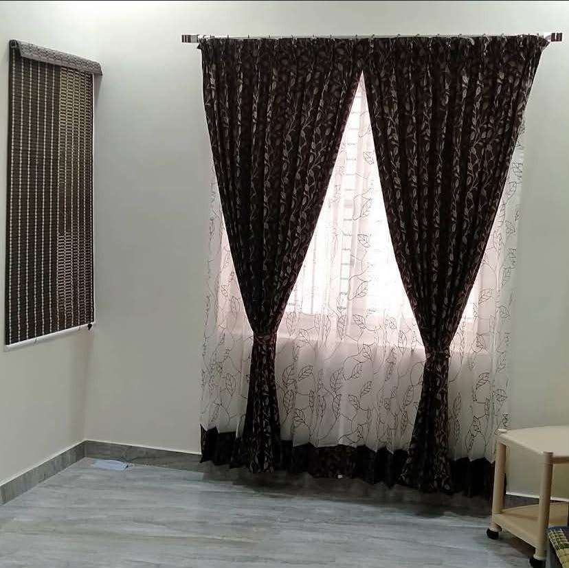 Brown patterned curtains with white sheers installation