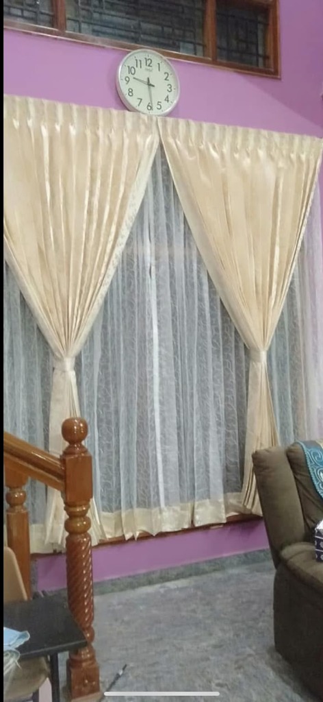 Ivory and gold sheer curtains installation