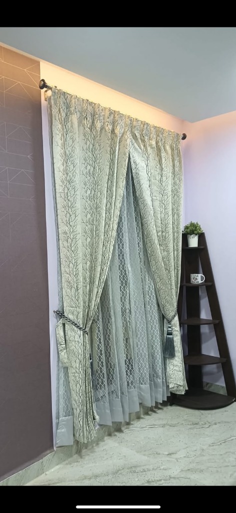 Ivory curtains with branch patterns